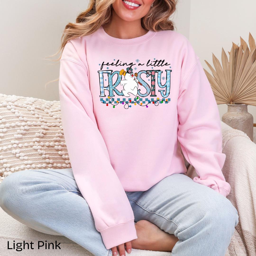 Feeling A Little Frosty Snowman Gildan Crewneck Sweatshirt in Light Pink
